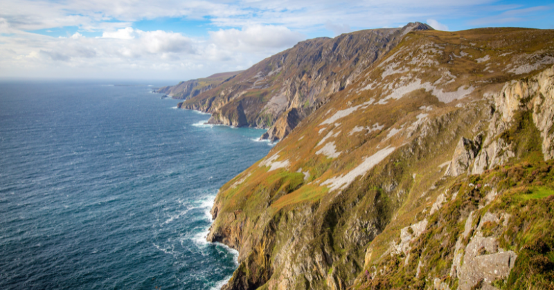 rocky cliff edge with the sea to the left