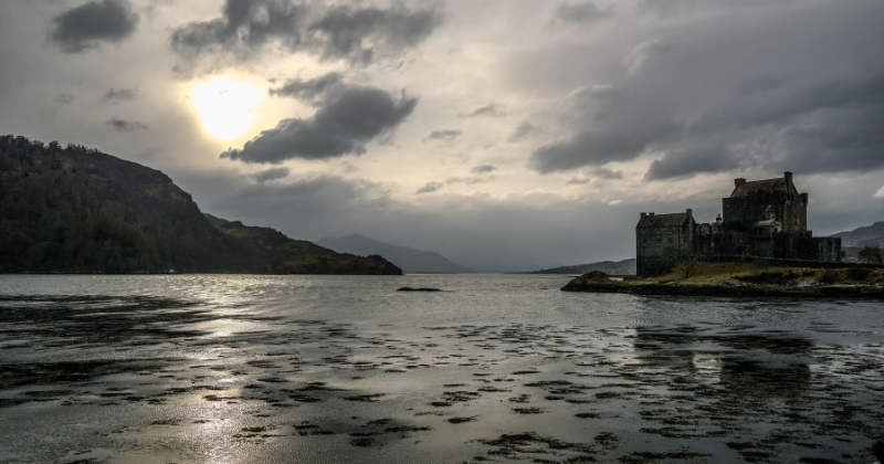 a castle on a tidal island on a loch