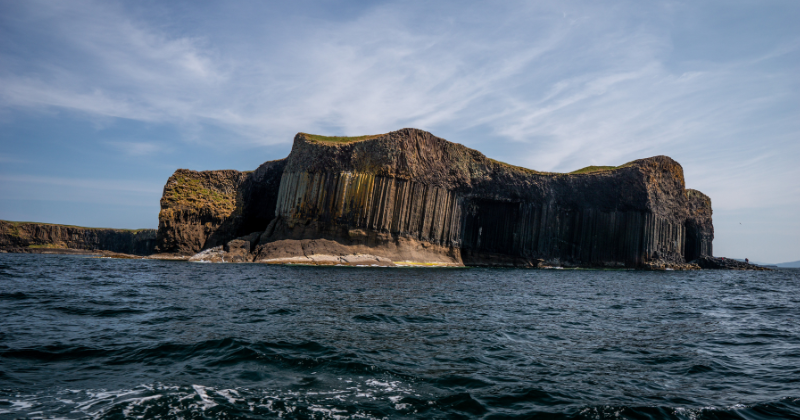 a rocky island on the water