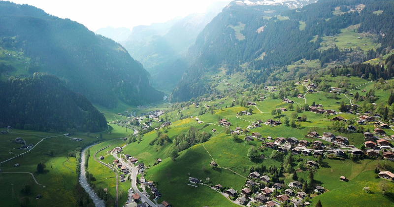 green mountain region with houses in the village below