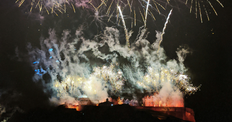Fireworks over a castle at night