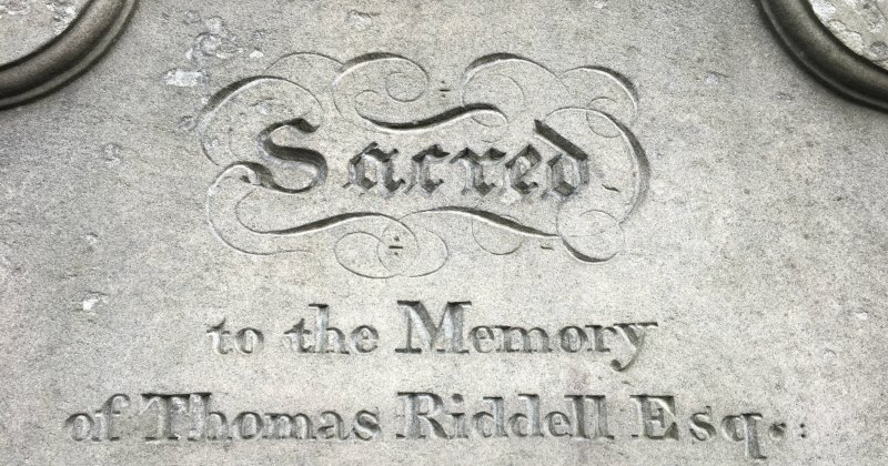 a stone slab gravestone