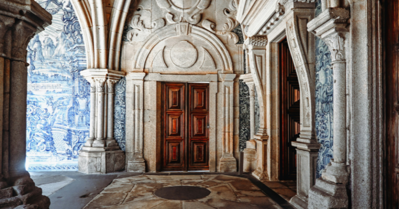 the interior of a beautiful building with columns and blue tiles