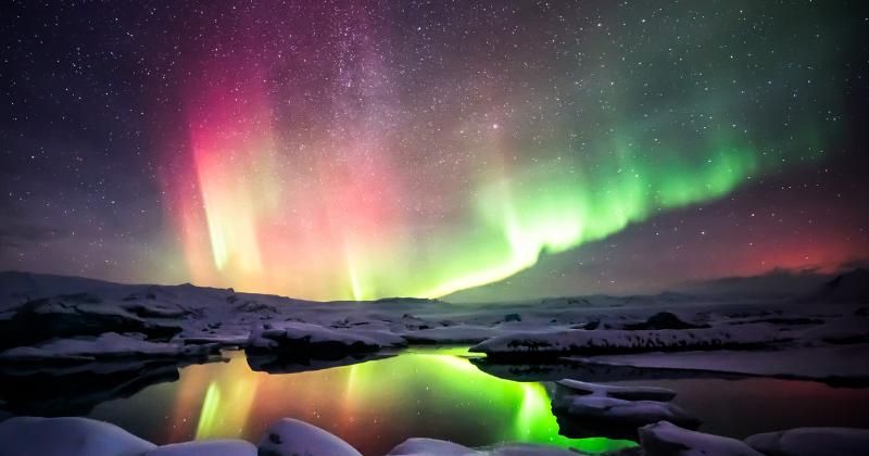 Colourful lights in the sky above snow