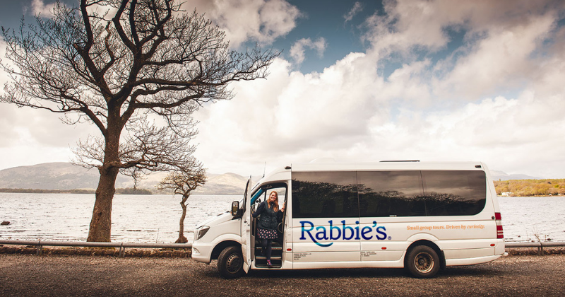 Rabbie's bus in front of a loch