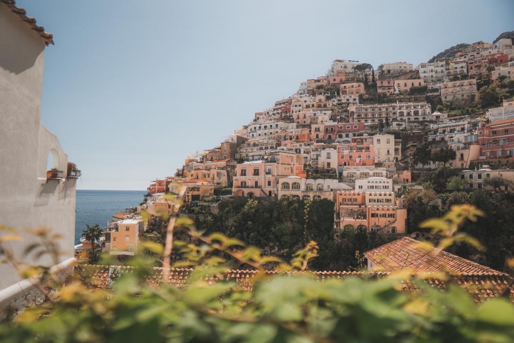 colourful houses on the side of an italian hilside