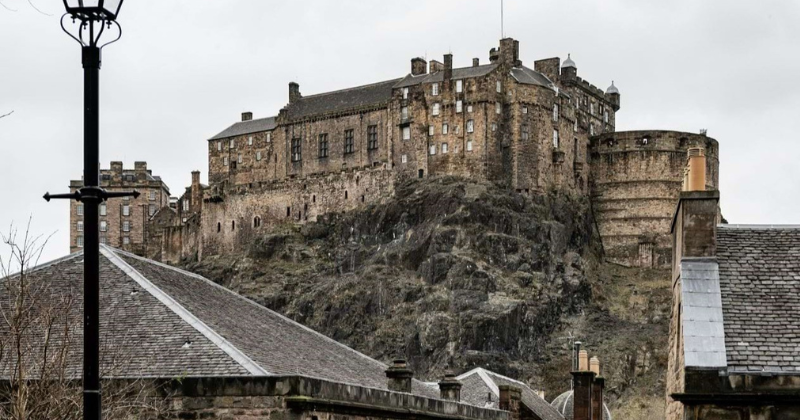 a castle looming over a city
