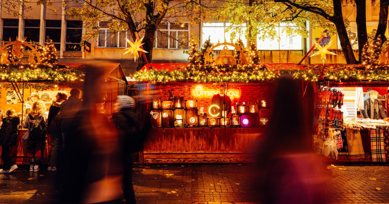a stall at a christmas market at night