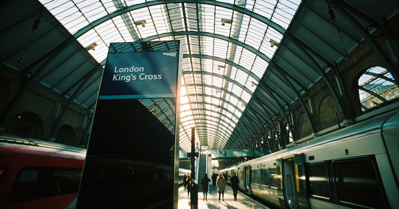 a modern train station with a sign that says London King's Cross