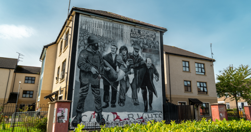 black and white painting drawn on the side of a building