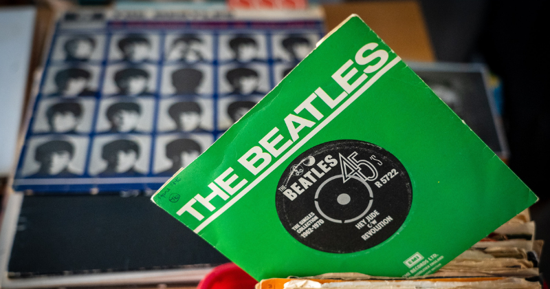 The Beatles vinal record in a green cover sleeve