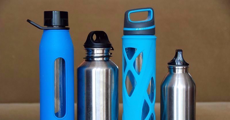 four water bottles lined in a row