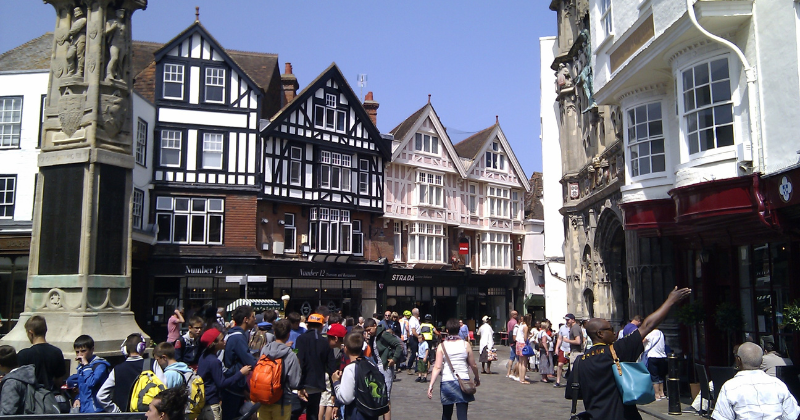 old buildings and people wandering around