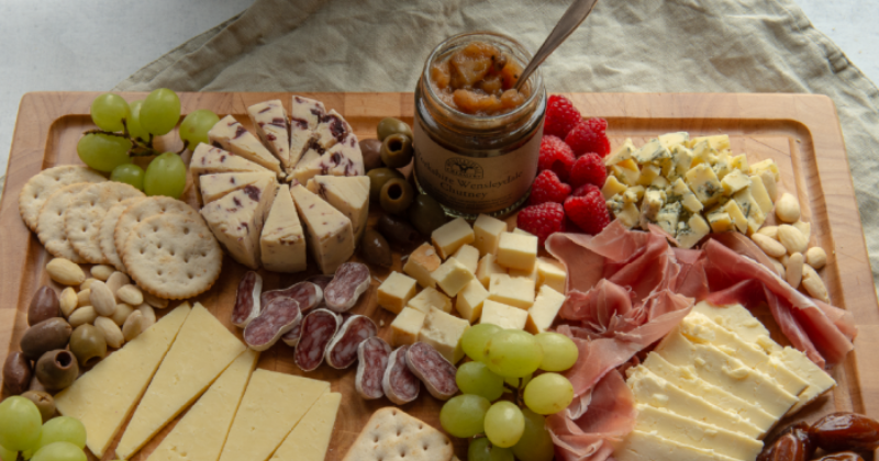 a platter of cheese and meat