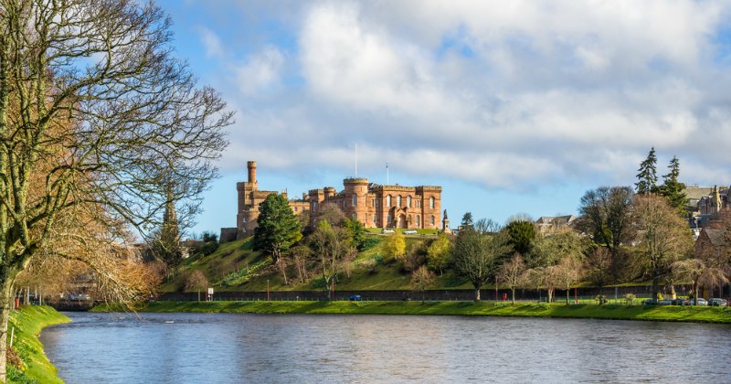 a castle overlooking a river