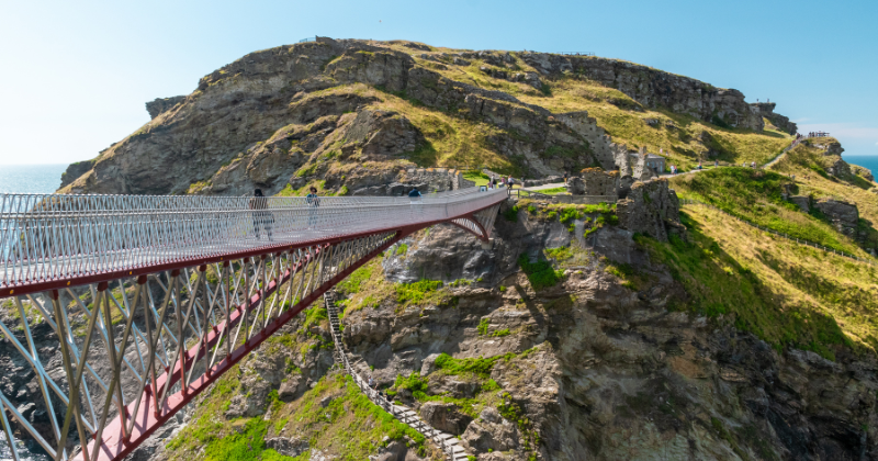 a bridge leading to a rocky outcrop