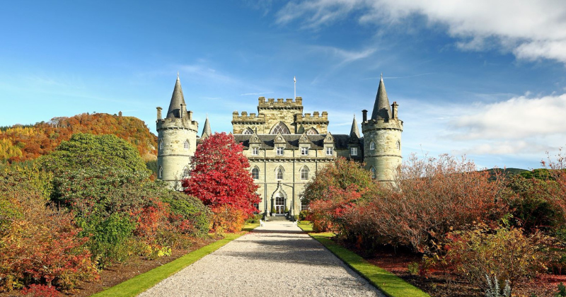 a castle at the end of a long driveway