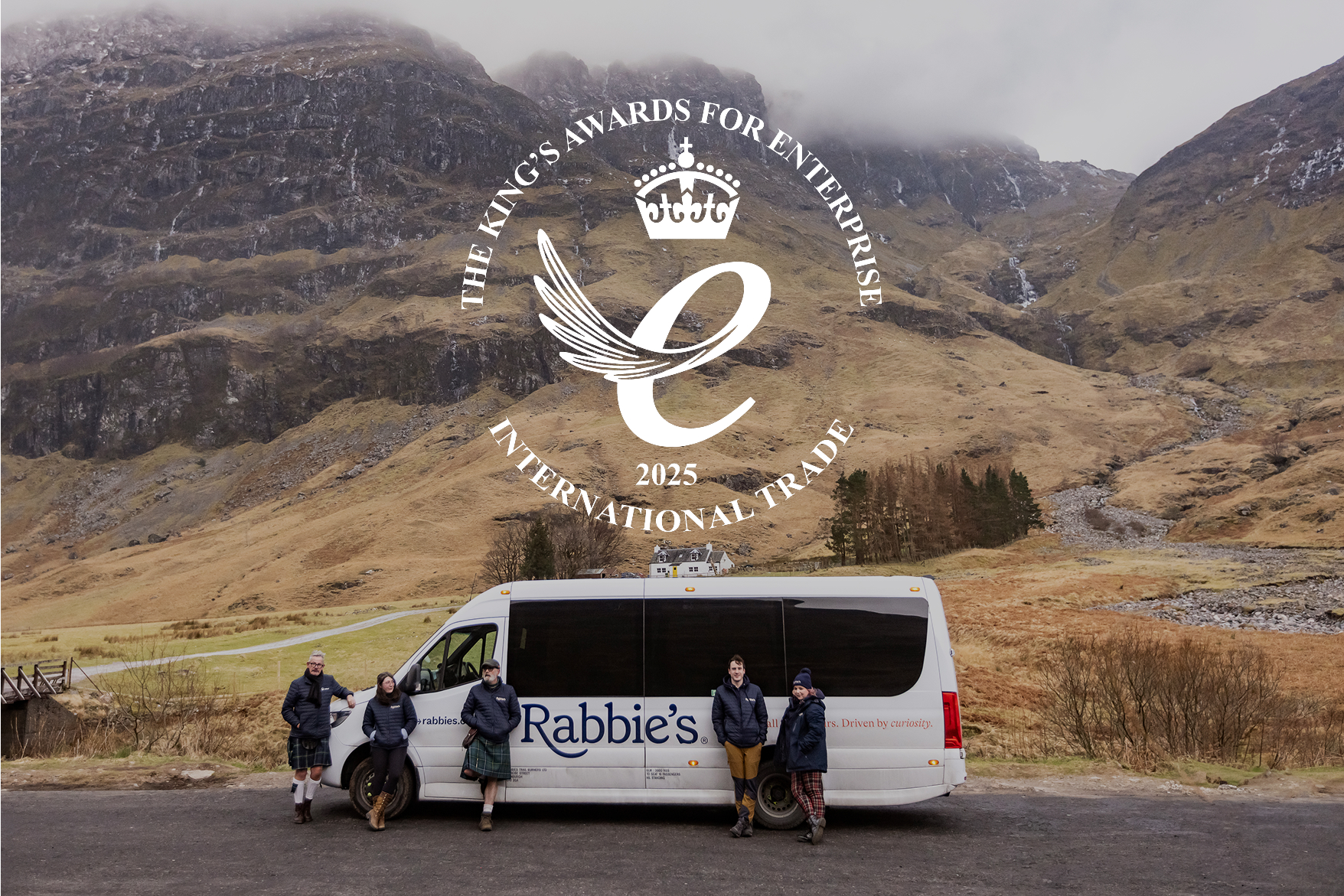 Rabbie's Bus in the Scottish Highlands with the Kings Award for Enterprise logo