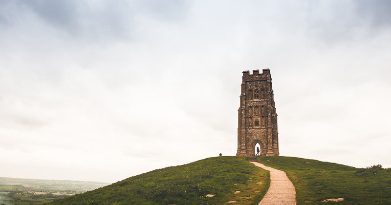 single building standing tall on top of a hill