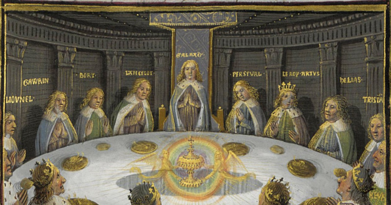 men in robes sitting around a round table