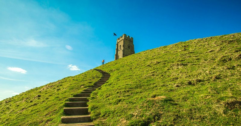 a stone tower on a hill