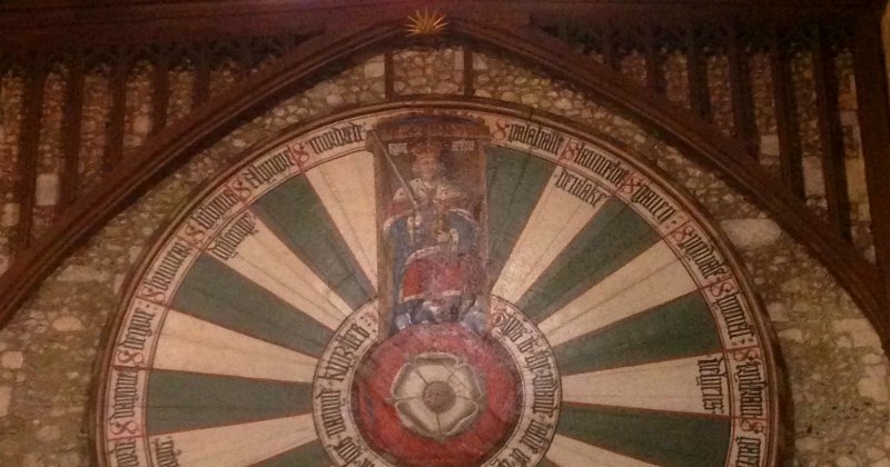 a round table symbol on a wall