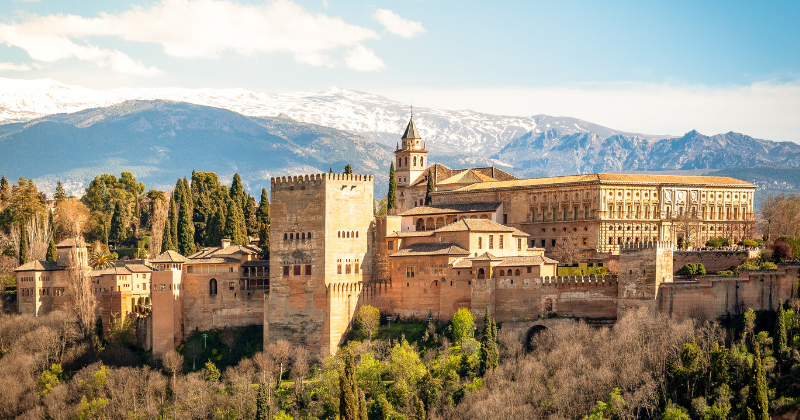 alhambra landscape in spain with mountains in the background