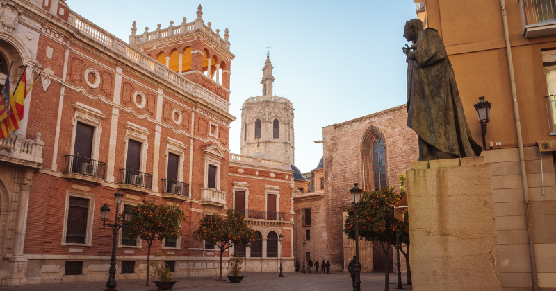 valencia street with a stone statue to the right