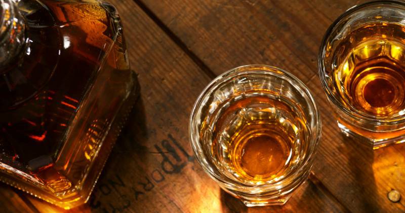 whisky glasses and a bottle