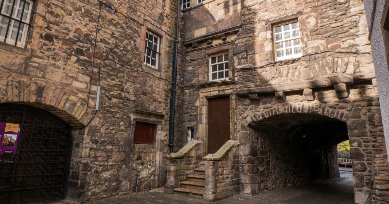 a stone building in a courtyard
