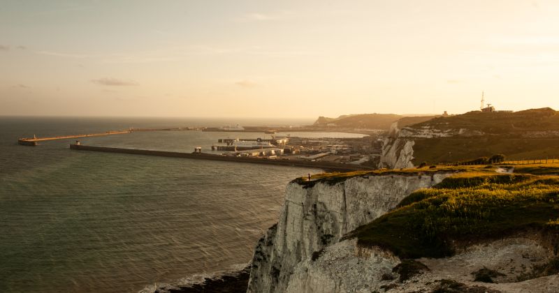 white cliffs overlooking the ocean at sunset