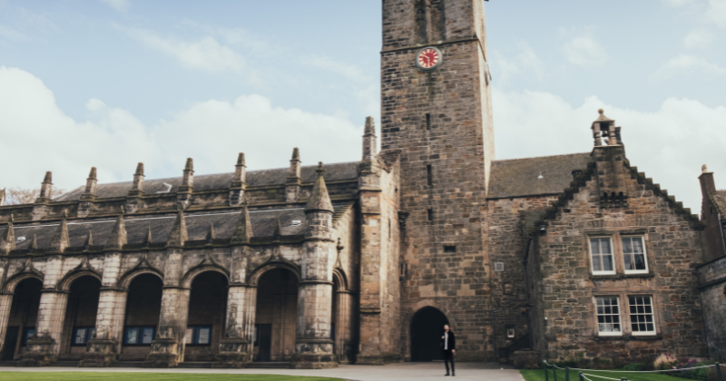 a great stone building with a clocktower