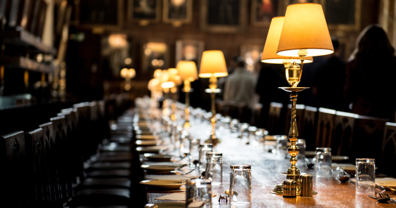 long table laid for dinner with lamps down the centre